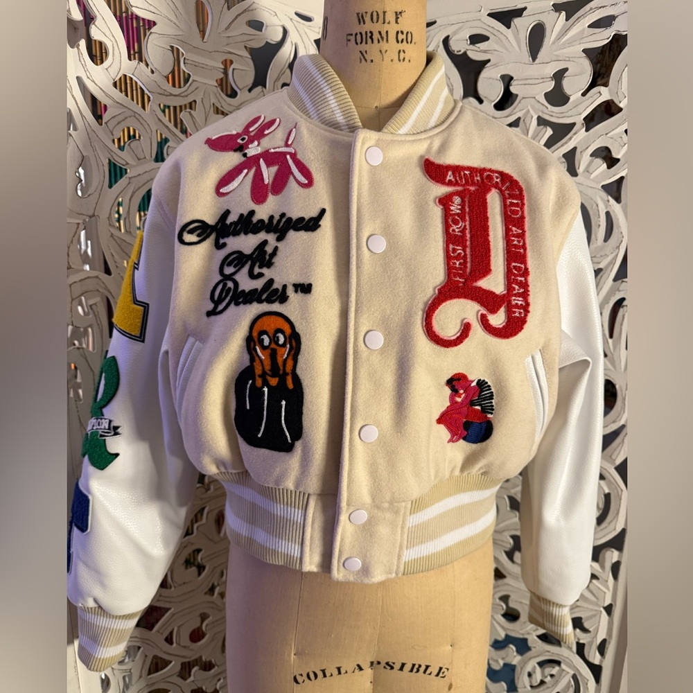 First Row 
Cream and White Varsity Jacket with Patches